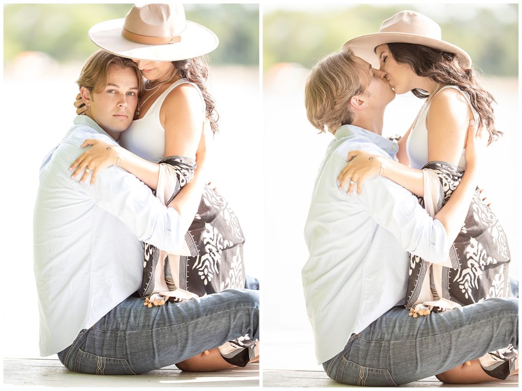 Man holding and kissing woman at Wall Lake, South Dakota during engagement session at sunset