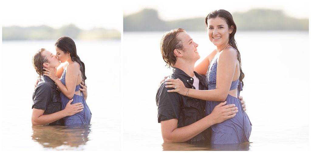 Engaged couple smiling at the camera at Wall Lake, South Dakota during engagement session at sunset