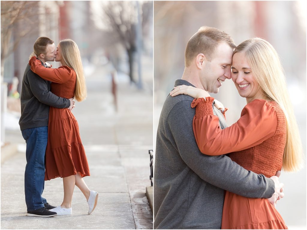 Engaged couple walking Downtown Sioux Falls during winter