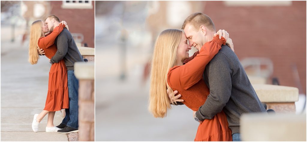 Engaged couple walking Downtown Sioux Falls during winter